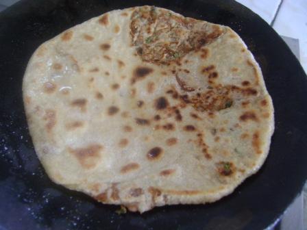 Once your paratha attains rich golden brown color from both the sides, it is cooked and ready to serve.